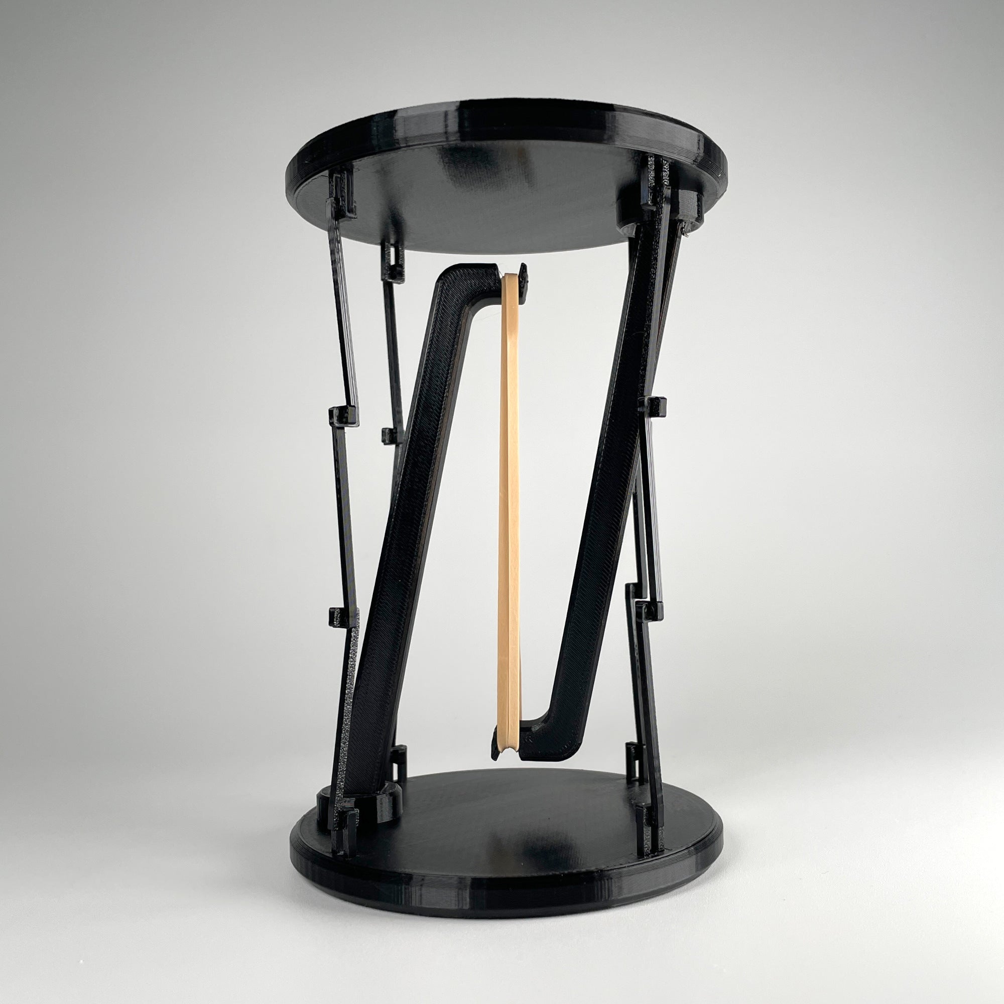 Tensegrity Display Stand — A puzzle-built stand that looks like it shouldn’t work