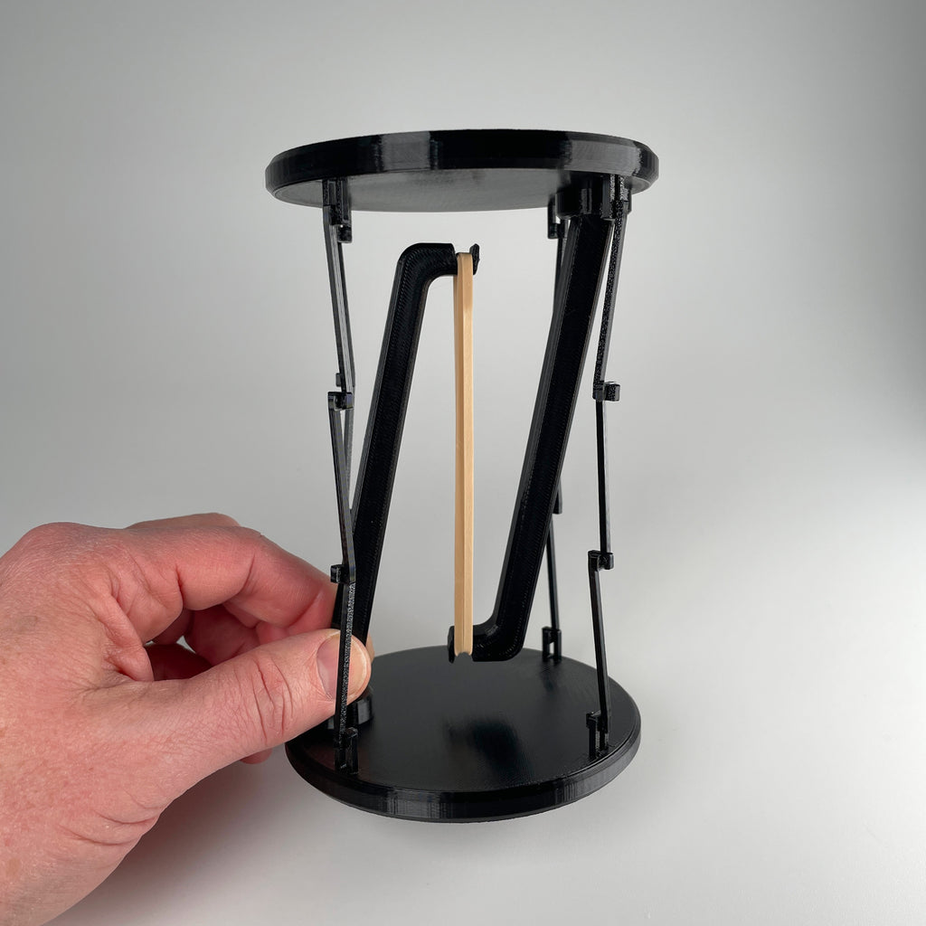 Tensegrity Display Stand — A puzzle-built stand that looks like it shouldn’t work